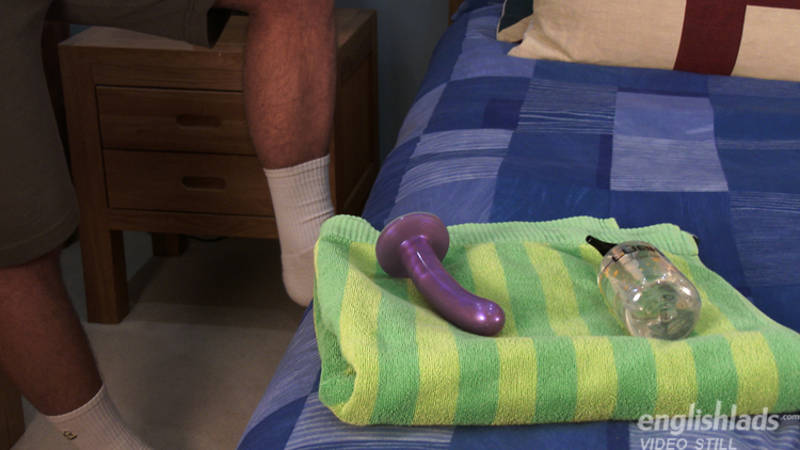 Long purple dildo and a bottle of lube waiting for straight guy Jaxon