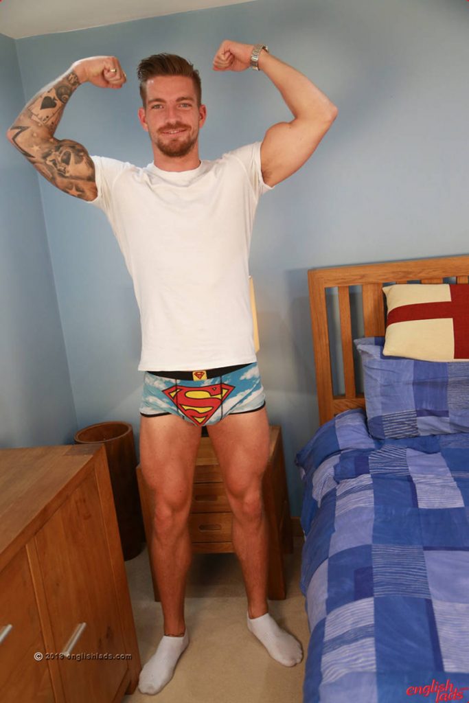 handsome and sexy straight man Hudston Scott posing in white t-shirt and superman underwear